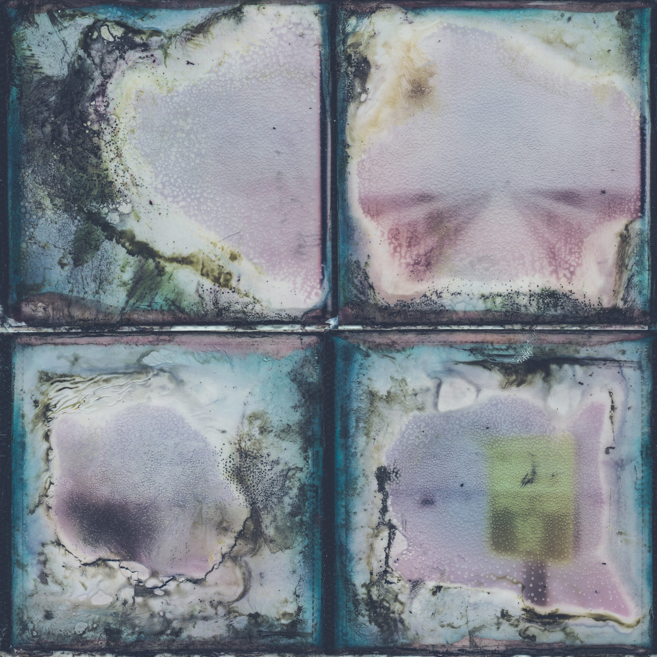 A collage of 4 different Polaroid images that have been decayed through a chemical soak.
