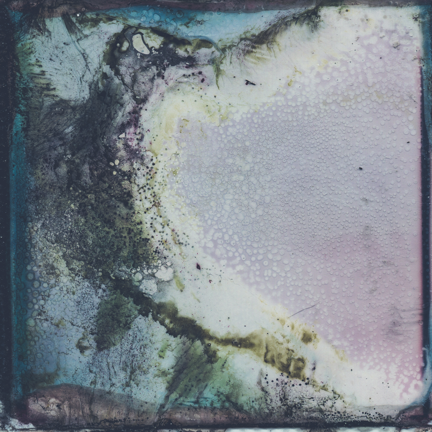 A Polaroid image that has been decayed through a chemical soak.